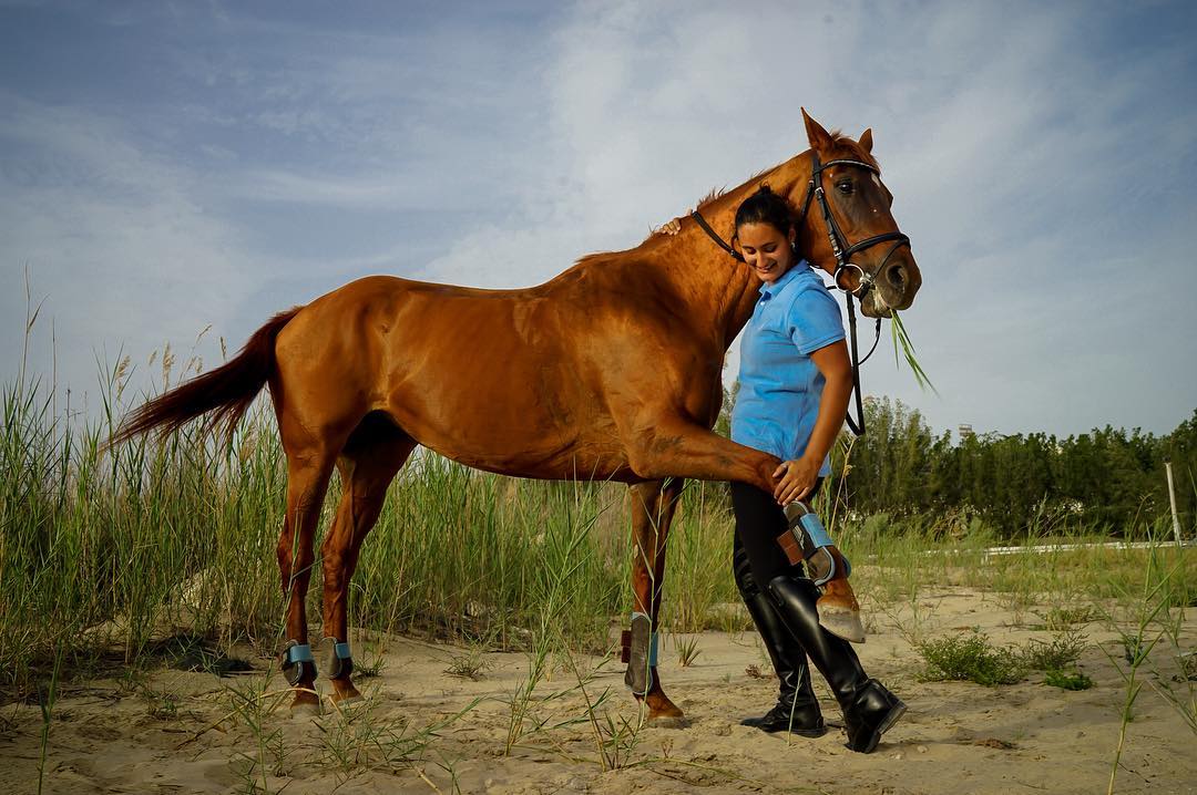 08 maart 2018: Photo and words by @tasneemalsultan (Tasneem Alsultan) | "I asked my father for a BMW, but he gifted me a horse instead" jokes Ekleel, a young Saudi and aspiring horseback rider, musician and sports enthusiast. “There are many restrictions that are specific to women in Saudi Arabia, such as the legal male guardianship and the longstanding ban on women driving, but I realize that it's only made us persevere in the fight for equal rights. Women's Day, in my experience, has been about celebrating the many women that have been tenacious fighters, in hopes for our daughters to understand the difference between privilege and basic human rights.” #PressforProgress #InternationalWomensDay #IWD2018 #WomensHistoryMonth #NatGeoWomen 

